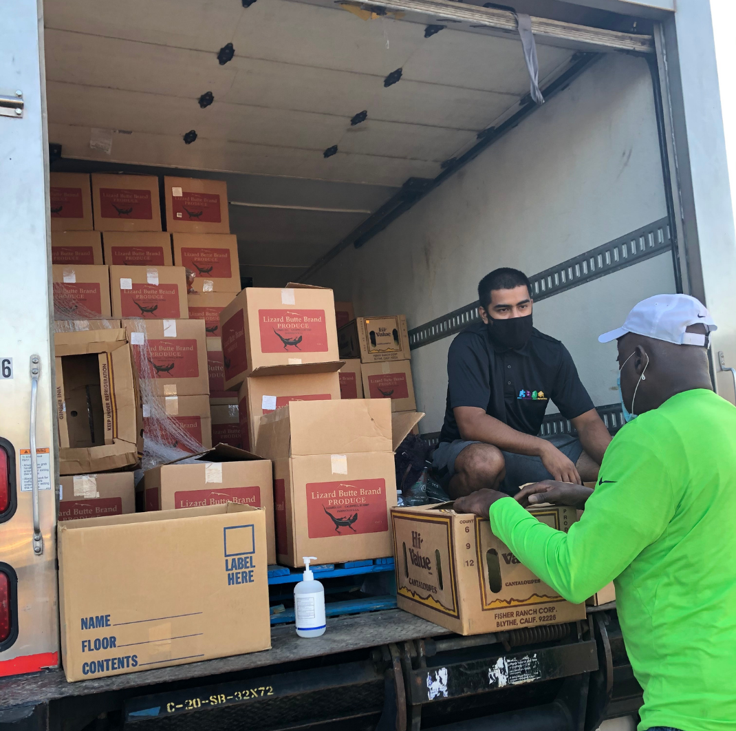 Ryan helps unload food for the community food pantry.