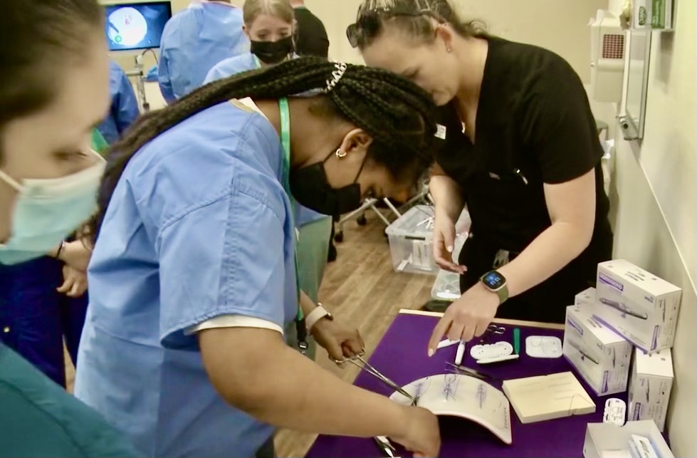 Camp participants learning to suture
