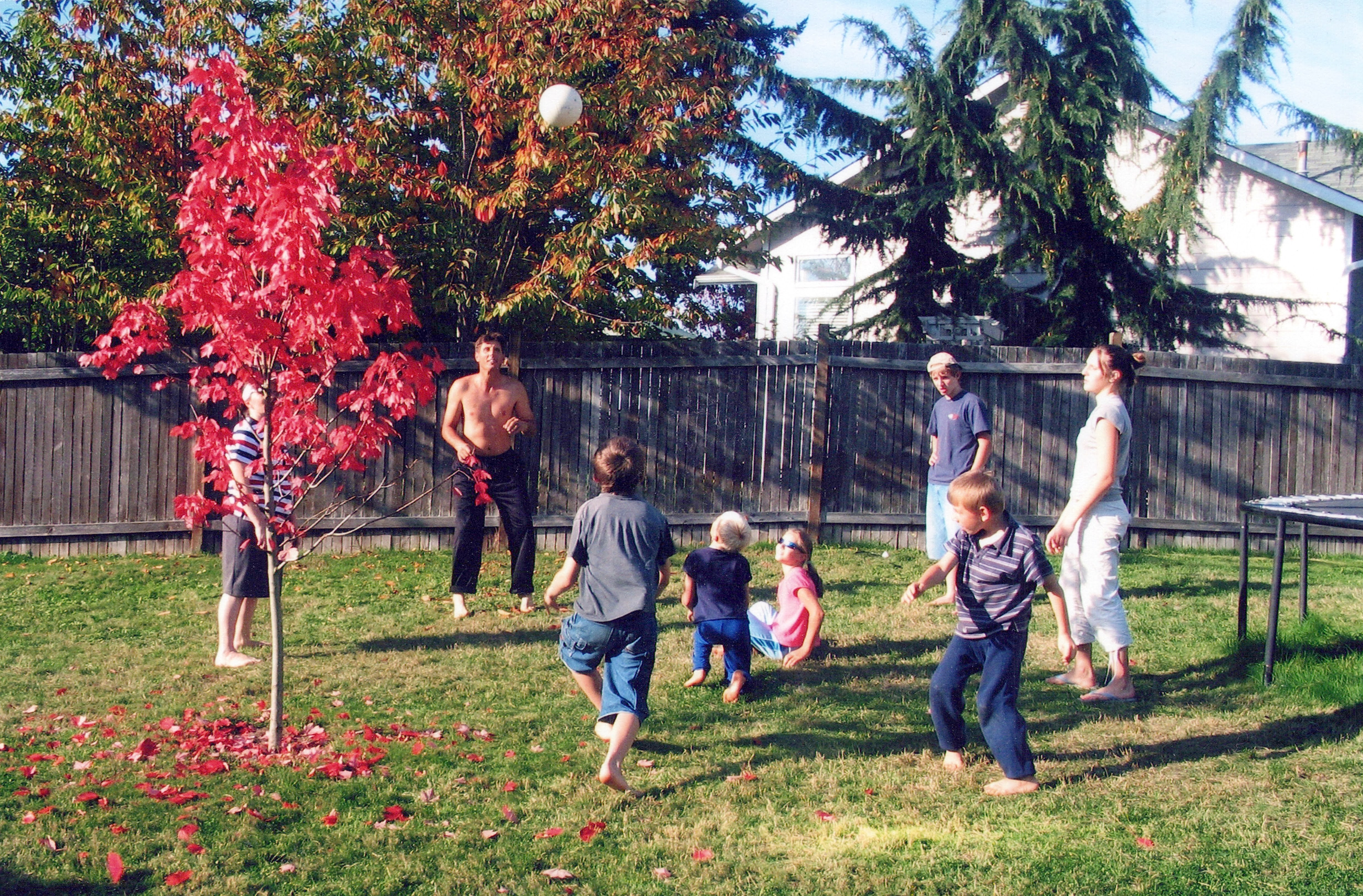 This is a picture of my parents and us siblings playing volleyball in our backyard. I’m the one sitting in the middle in pink, with glasses on. This picture was from Fall 2006. I was 9.