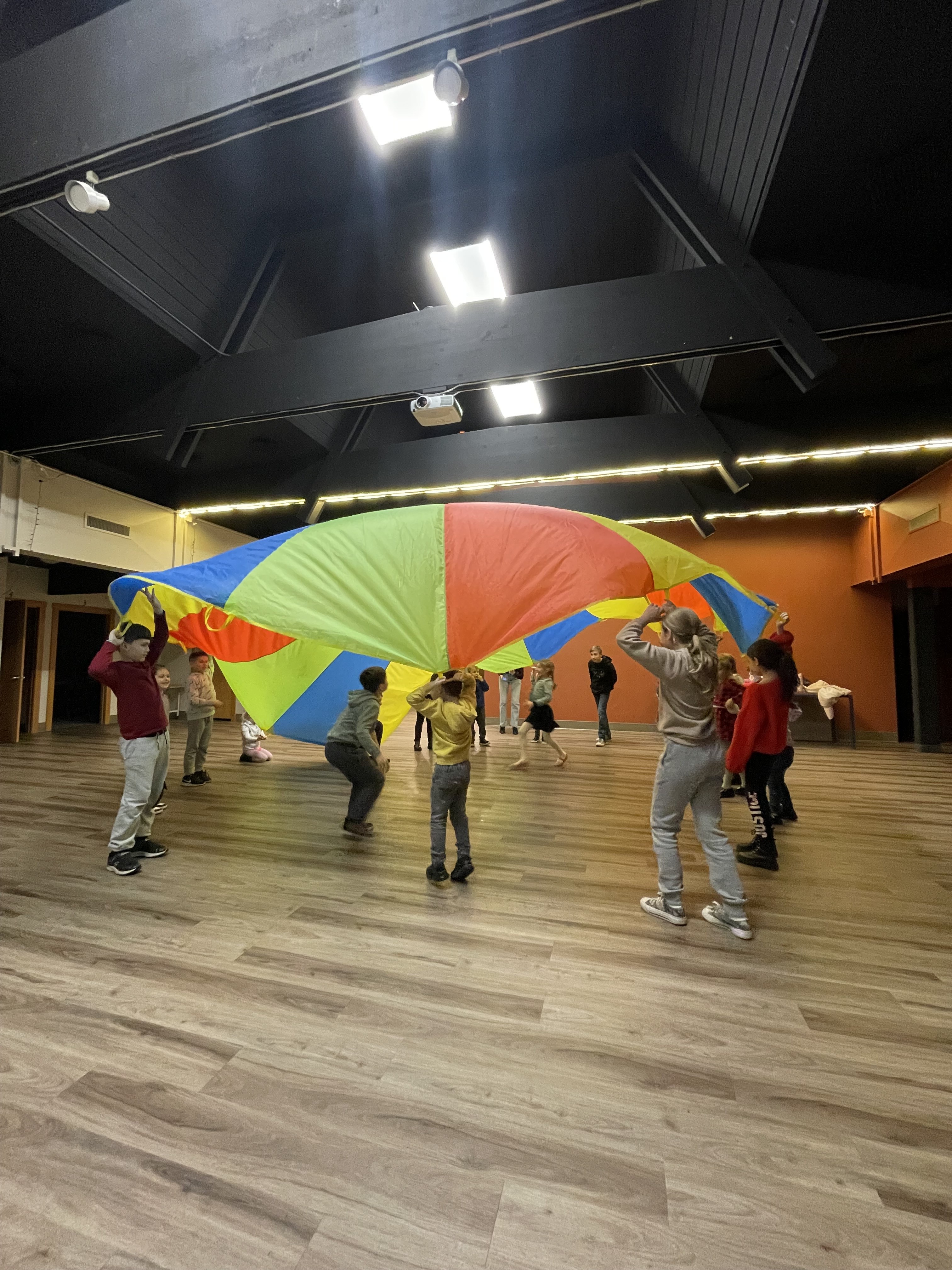 The kids playing a parachute game – I was leading so I’m not in the picture