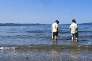 572DD23D-57EA-4361-A71E-AD999626284C- two kids are in the ocean.